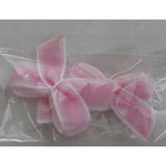 Decoro fiocco di stoffa rosa con bordi bianchi